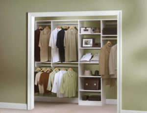A well-organized walk-in closet with neatly arranged clothes and accessories.