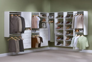 Organized corner closet featuring a variety of clothing and storage options.