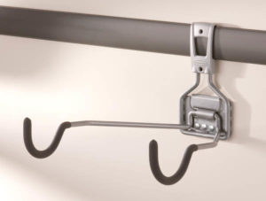 Metal hook attachment on a horizontal pole.