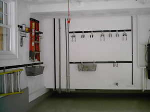A clean and organized utility room with safety equipment and a sink.