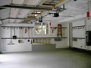 Clean and organized garage interior with tools neatly hung on the wall.