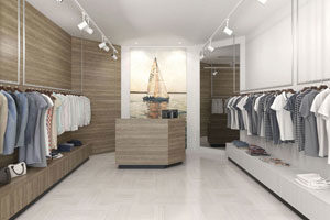 Modern and neatly organized clothing store interior with a nautical theme.