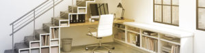 A minimalist office setup with a white desk, chair, shelving units, staircase, and natural light.