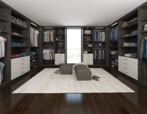 Modern walk-in closet with built-in wardrobes and a center island.