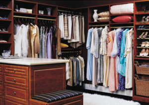 Walk-in closet with organized clothing and accessories.