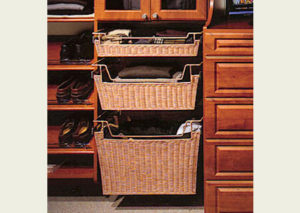 Open wooden dresser with fabric-lined drawers containing clothing and accessories.