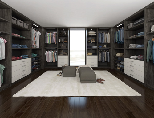 Modern walk-in closet with built-in storage units and central seating area.