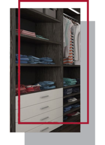 Custom organized closet with folded clothes and hanging garments.