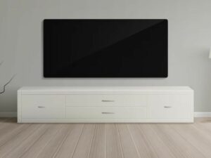 A large flat-screen television mounted on a wall above a white entertainment console in a minimalist room.