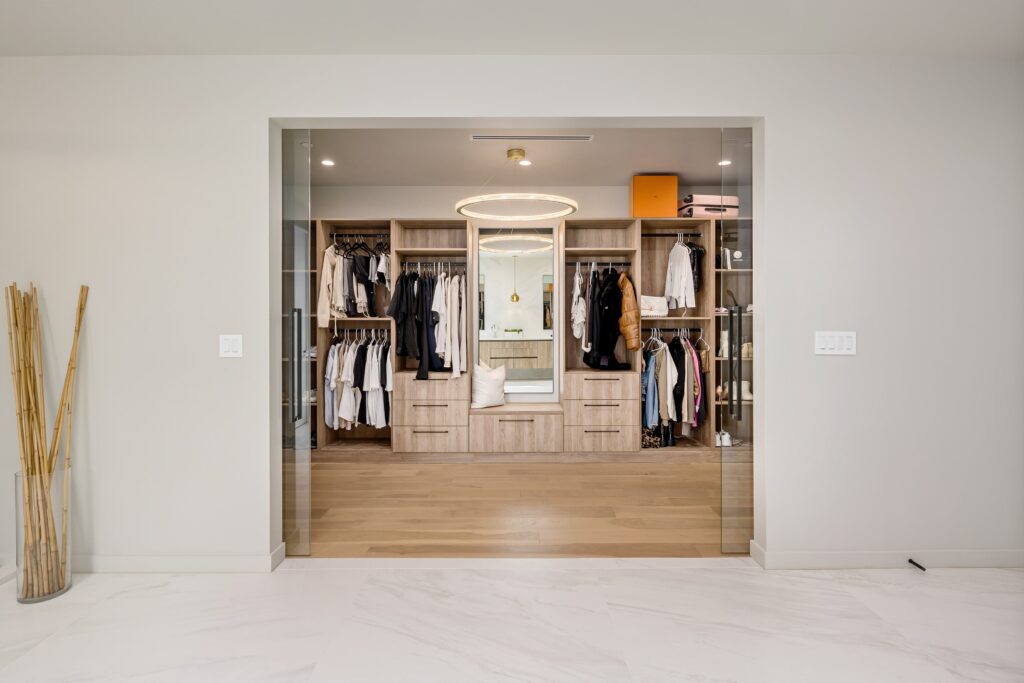 an-empty-walk-in-closet-with-lots-of-drawers-and-organization - Boston ...