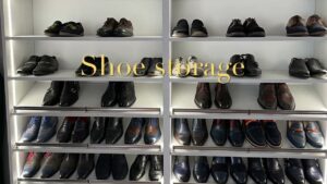 Shelves filled with various pairs of men's dress shoes and casual shoes organized neatly.